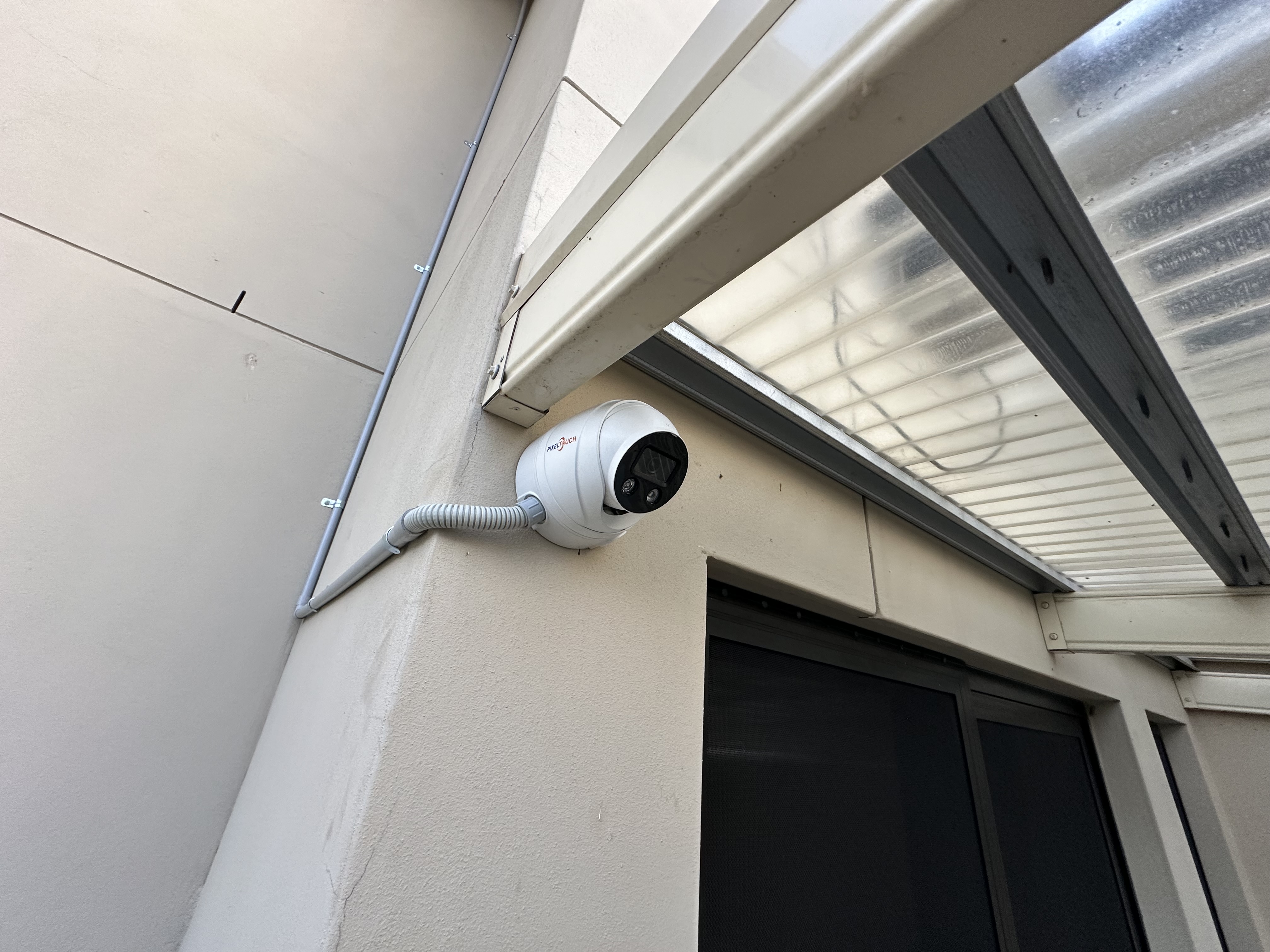 PixelTouch ball camera on render wall, courtyard