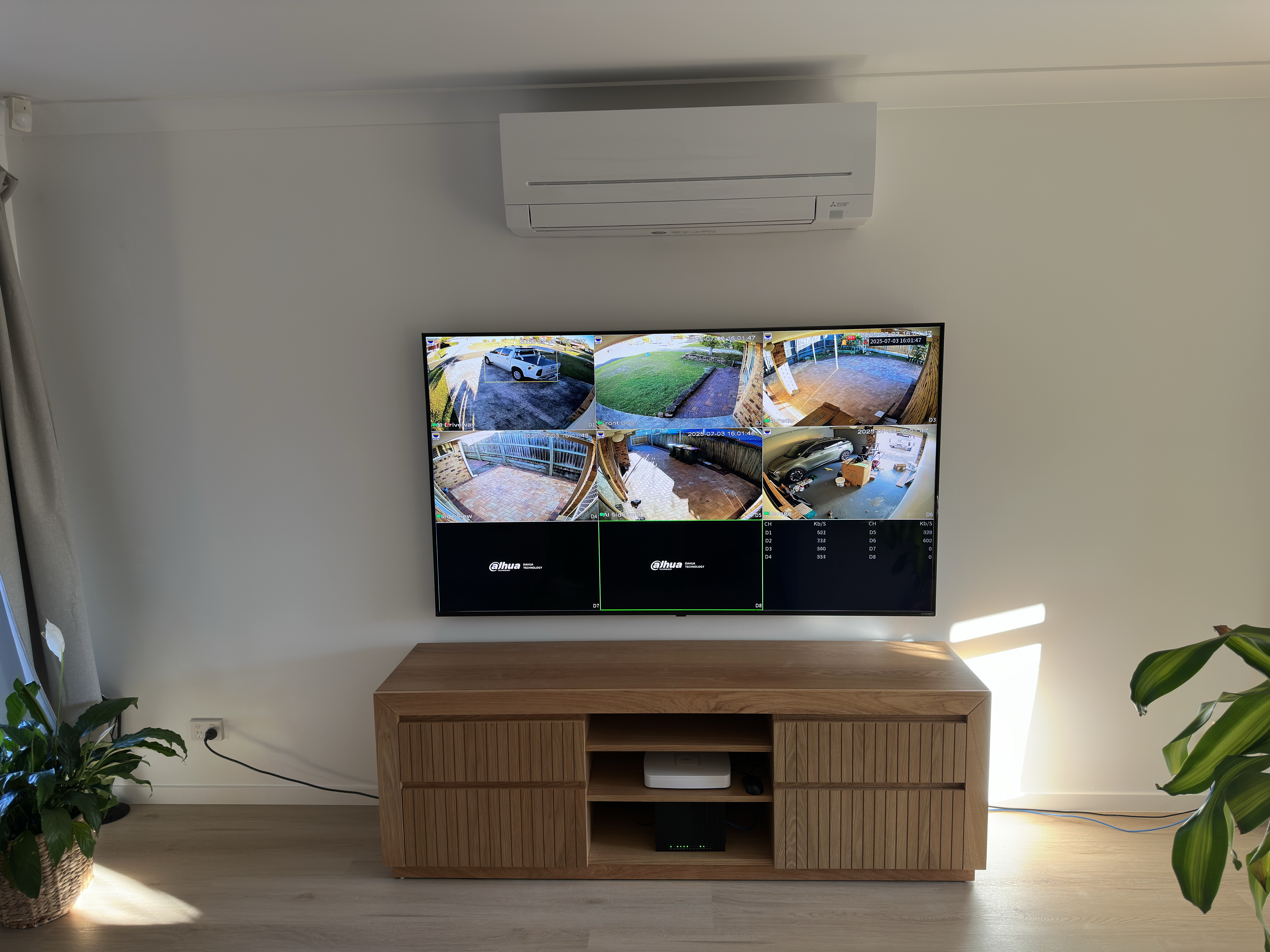 TV displaying Dahua CCTV NVR multi-camera view